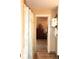 Hallway leading to neutral bathroom with decorative cabinet in the background at 4040 Merritt Dr, Cumming, GA 30041