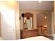 Upstairs bedroom with a decorative wood dresser and arched entrance to the hall at 4040 Merritt Dr, Cumming, GA 30041