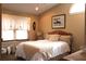 Bedroom featuring a comfortable bed, decor, and a large window for natural light at 4040 Merritt Dr, Cumming, GA 30041
