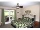 Comfortable bedroom with ceiling fan, patio access, and leafy green accents at 4040 Merritt Dr, Cumming, GA 30041