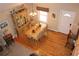 Bright dining area featuring hardwood floors, a large window, and seating for eight at 4040 Merritt Dr, Cumming, GA 30041
