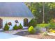 Close up of meticulously maintained landscaping, rock features, and custom outdoor decorations at 4040 Merritt Dr, Cumming, GA 30041