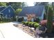 Charming home with well-manicured landscaping, rock accents, and a long driveway at 4040 Merritt Dr, Cumming, GA 30041
