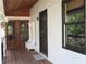 Inviting front porch features a wooden bench, coat hooks, and a welcome mat at 4040 Merritt Dr, Cumming, GA 30041