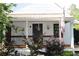 Charming front porch with hanging plants and black door, perfect for relaxing at 4040 Merritt Dr, Cumming, GA 30041