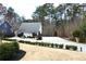 Charming home featuring a well-manicured front yard with lush landscaping and a spacious driveway at 4040 Merritt Dr, Cumming, GA 30041
