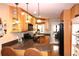 Well-equipped kitchen with stainless steel appliances, stone counters, and hardwood floors at 4040 Merritt Dr, Cumming, GA 30041