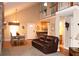 Spacious living room with high ceilings, staircase, and seamless transition to dining area creates a welcoming atmosphere at 4040 Merritt Dr, Cumming, GA 30041