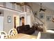 Bright living room features vaulted ceilings, a staircase leading to a loft, and an open layout perfect for gatherings at 4040 Merritt Dr, Cumming, GA 30041