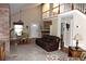 Bright living room with vaulted ceiling, stone fireplace, and seamless flow to dining area at 4040 Merritt Dr, Cumming, GA 30041