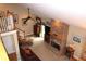 Open concept living room with a stone fireplace, leather furniture, and an upper level loft area at 4040 Merritt Dr, Cumming, GA 30041