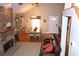 Open-concept living room flows into dining area, with a stone fireplace and hardwood floors, creating a comfortable living space at 4040 Merritt Dr, Cumming, GA 30041