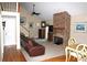 Cozy living room with stone fireplace, neutral carpeting, and staircase to second floor at 4040 Merritt Dr, Cumming, GA 30041