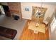 Open-concept living and dining area with fireplace and hardwood flooring offers ample space at 4040 Merritt Dr, Cumming, GA 30041