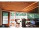 Relaxing screened-in porch with wood ceiling, grill, furniture, and plenty of natural light at 4040 Merritt Dr, Cumming, GA 30041