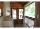Inviting screened porch featuring double doors, wood ceiling and a view of the outdoors at 4040 Merritt Dr, Cumming, GA 30041