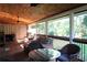 Spacious screened porch with ceiling fans, comfortable seating, and peaceful backyard views at 4040 Merritt Dr, Cumming, GA 30041