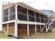 Spacious screened-in porch with convenient access to the backyard and ample room for outdoor relaxation and entertaining at 4040 Merritt Dr, Cumming, GA 30041