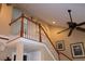 Elegant staircase with wooden banister and white spindles leading to the upper level of the home at 4040 Merritt Dr, Cumming, GA 30041