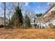 Spacious backyard featuring a white-sided house and a lush lawn, perfect for outdoor activities and relaxation at 1283 Hada Ct, Lawrenceville, GA 30043