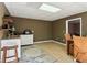 Finished basement featuring wet bar with mini-fridge and sink, perfect for entertaining at 1283 Hada Ct, Lawrenceville, GA 30043