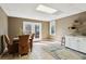 Basement area showcasing tile floors, a wet bar, and natural light from French doors at 1283 Hada Ct, Lawrenceville, GA 30043