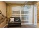 Basement sitting area featuring a bench, accent wall with mural, and bright natural light at 1283 Hada Ct, Lawrenceville, GA 30043