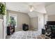 This bedroom includes two windows, a ceiling fan, a bookshelf and space for a desk and chair at 1283 Hada Ct, Lawrenceville, GA 30043