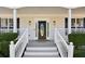 Elegant front door with decorative glass, flanked by sidelights, and white railing at 1283 Hada Ct, Lawrenceville, GA 30043