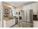 Well-equipped kitchen with stainless steel appliances and adjacent to the living room at 1283 Hada Ct, Lawrenceville, GA 30043