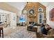 Inviting living room with a stone fireplace, vaulted ceiling, and cozy seating at 1283 Hada Ct, Lawrenceville, GA 30043