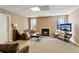 Cozy living room features a fireplace, comfortable seating, natural light from windows, and tv on a stand at 1283 Hada Ct, Lawrenceville, GA 30043