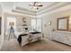 Spacious main bedroom with a tray ceiling, neutral decor, and lots of natural light at 1283 Hada Ct, Lawrenceville, GA 30043