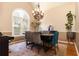 Dining room featuring a chandelier, large window, and hardwood floors at 2250 Snug Ne Hbr, Marietta, GA 30066