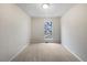 This bedroom features carpeted floors, white walls, a window, and overhead lighting at 3153 Kingswood Gln, Decatur, GA 30034