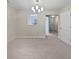 Cozy dining room with elegant chandelier and neutral carpet with great natural light at 3153 Kingswood Gln, Decatur, GA 30034