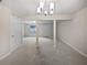 View of dining room with neutral carpet and paint featuring an opening with support columns at 3153 Kingswood Gln, Decatur, GA 30034