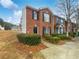 Charming brick home with well-maintained landscaping and a cozy front entrance, nestled under a bright blue sky at 3153 Kingswood Gln, Decatur, GA 30034