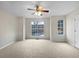 Bright living room featuring a ceiling fan and lots of light from the window at 3153 Kingswood Gln, Decatur, GA 30034