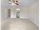 Expansive main bedroom featuring a ceiling fan, and a view into the main bathroom at 3153 Kingswood Gln, Decatur, GA 30034