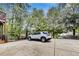 Spacious concrete backyard featuring a basketball court and a white SUV parked on the property at 3580 S Sherwood Se Rd, Smyrna, GA 30082