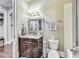 Bathroom featuring a dark wood vanity and a decorative mirror, providing ample space for your toiletries at 3580 S Sherwood Se Rd, Smyrna, GA 30082