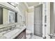 Bathroom featuring granite counters, grey wood style floors, and neutral paint at 3580 S Sherwood Se Rd, Smyrna, GA 30082