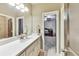 Bathroom featuring double sinks with vanity and view into Bedroom at 3580 S Sherwood Se Rd, Smyrna, GA 30082