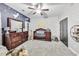 Charming Bedroom with wood accent wall, dresser, crib, and soft carpet at 3580 S Sherwood Se Rd, Smyrna, GA 30082