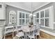 Cozy breakfast nook featuring multiple windows, natural light, and hardwood flooring at 3580 S Sherwood Se Rd, Smyrna, GA 30082