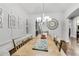 Formal dining room with hardwood floors and decorative wall trim at 3580 S Sherwood Se Rd, Smyrna, GA 30082