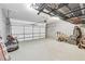 Spacious two car garage with epoxy flooring and overhead storage at 3580 S Sherwood Se Rd, Smyrna, GA 30082