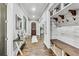 Hallway with hardwood floors, neutral paint, with a built in hall tree at 3580 S Sherwood Se Rd, Smyrna, GA 30082