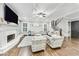 Elegant living room with fireplace, hardwood floors, and neutral décor at 3580 S Sherwood Se Rd, Smyrna, GA 30082